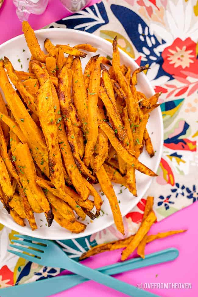 a plate full of sweet potato fries.