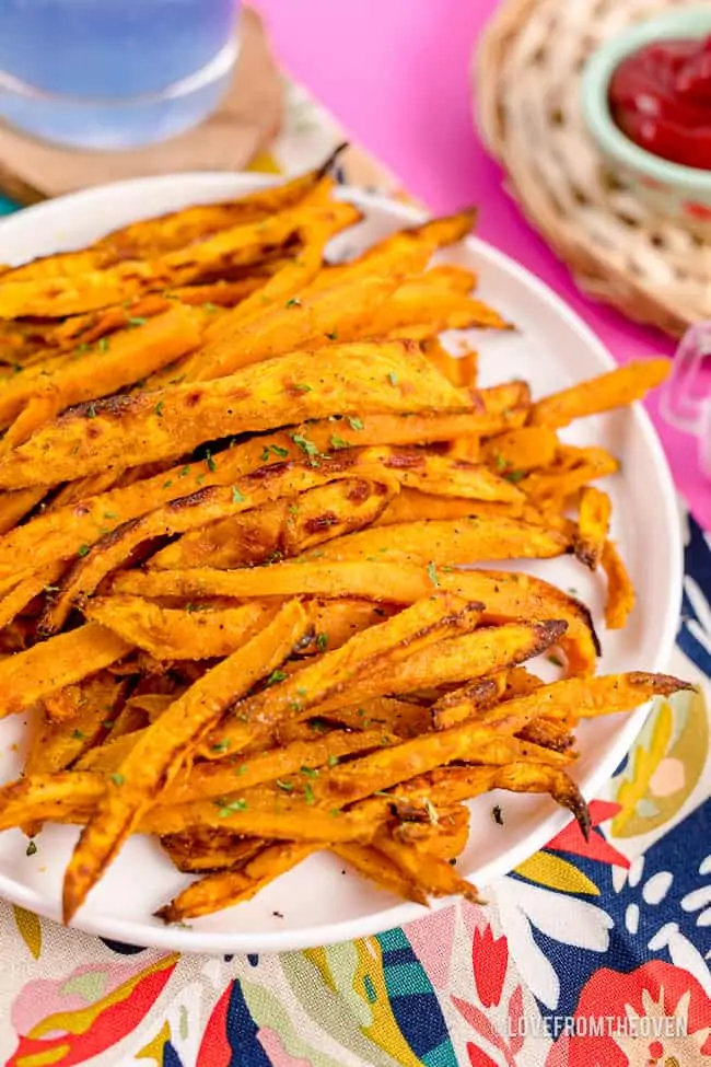 A plate full of sweet potato fries.