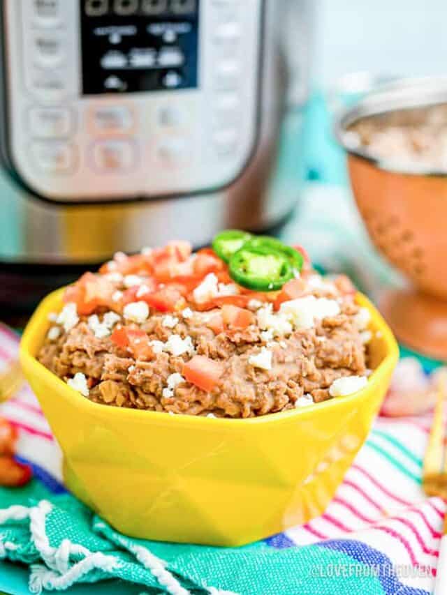 A bowl of homemade refried beans in front of an Instant pot.