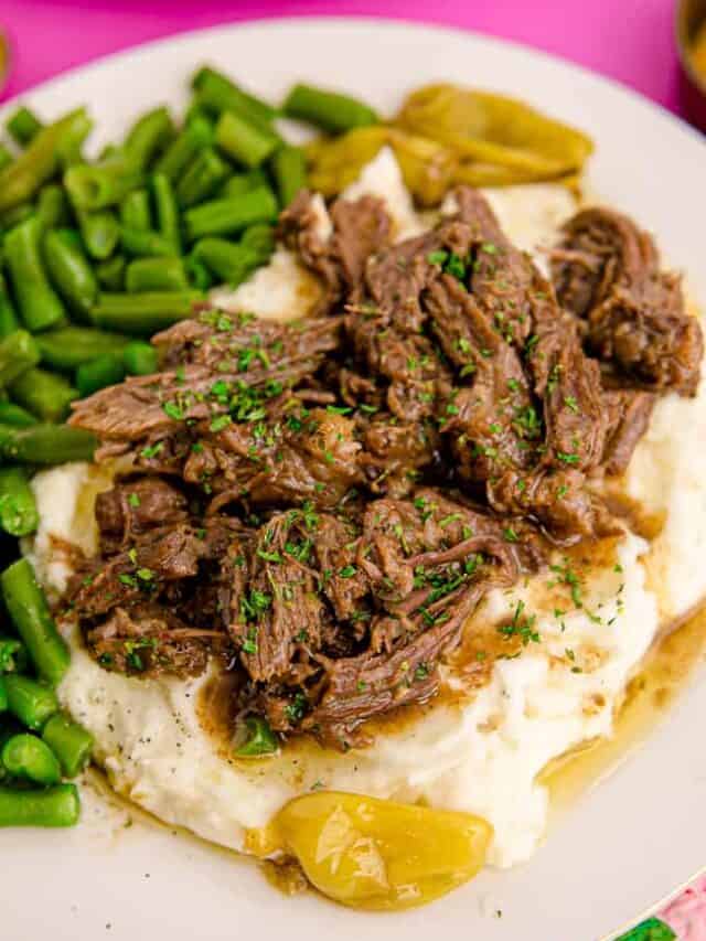 a plate with roast potatoes and green beans