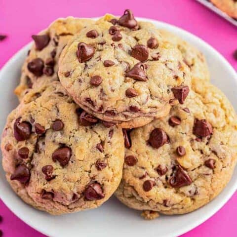 Chocolate chip cookies on a pink background.