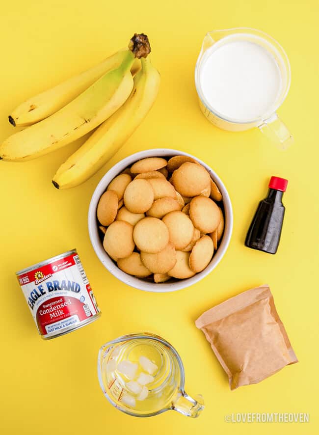 Ingredients to make Magnolia bakery banana pudding, on a yellow background.