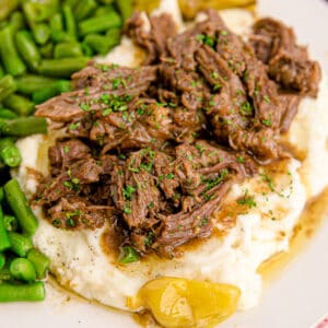 a plate of mississippi pot roast and mashed potatoes