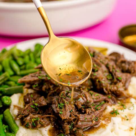 Gravy being poured over Mississippi Pot Roast.