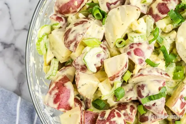 A bowl of red potato salad.