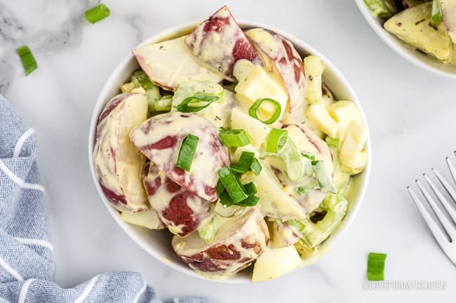 An overhead photo of a bowl of potato salad.