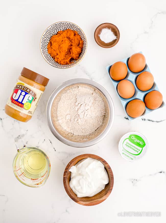 Ingredients to make a dog cake on a white background.