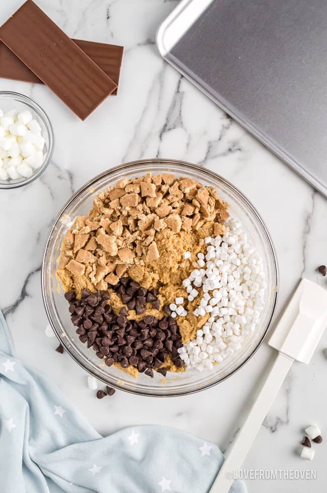 a bowl of ingredients to make smores cookies