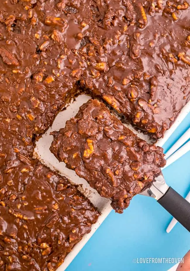 A slice of Texas sheet cake being cut.
