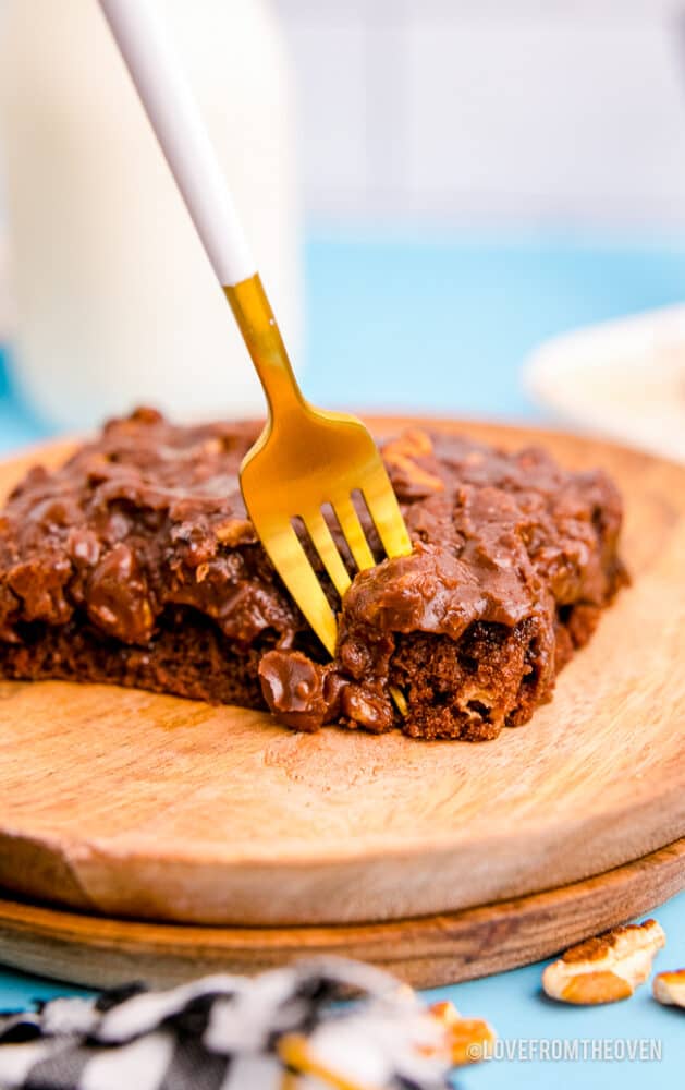 A fork taking a piece of Texas sheet cake