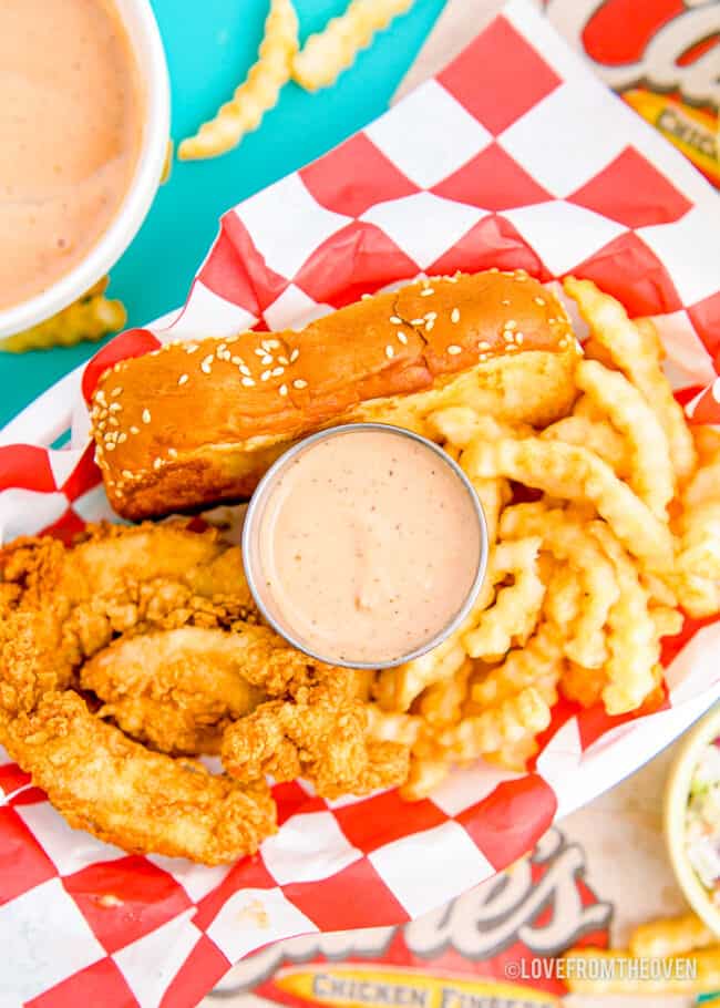 Canes sauce with chicken and fries.