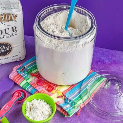 A glass container filled with flour.