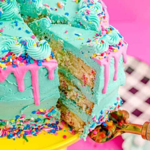 A funfetti cake being served.