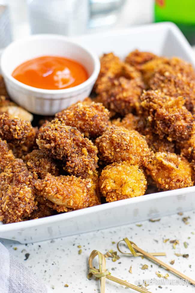 A plate full of popcorn chicken