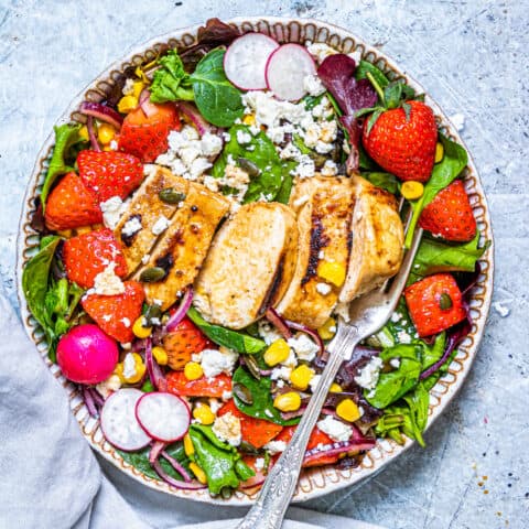 A bowl of strawberry chicken salad