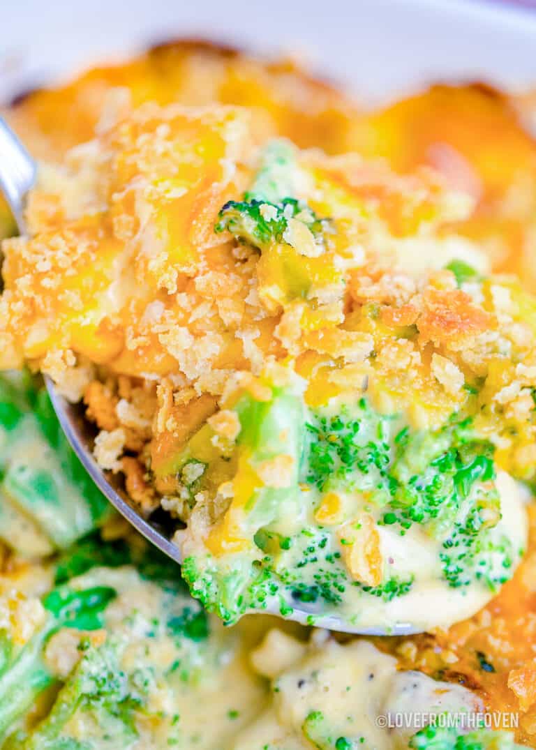 A close up of a broccoli casserole with ritz crackers
