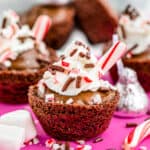 A brownie made to look like a mug of hot chocolate with a candy cane