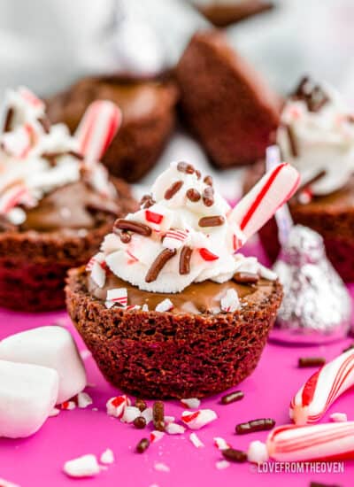 A brownie made to look like a mug of hot chocolate with a candy cane