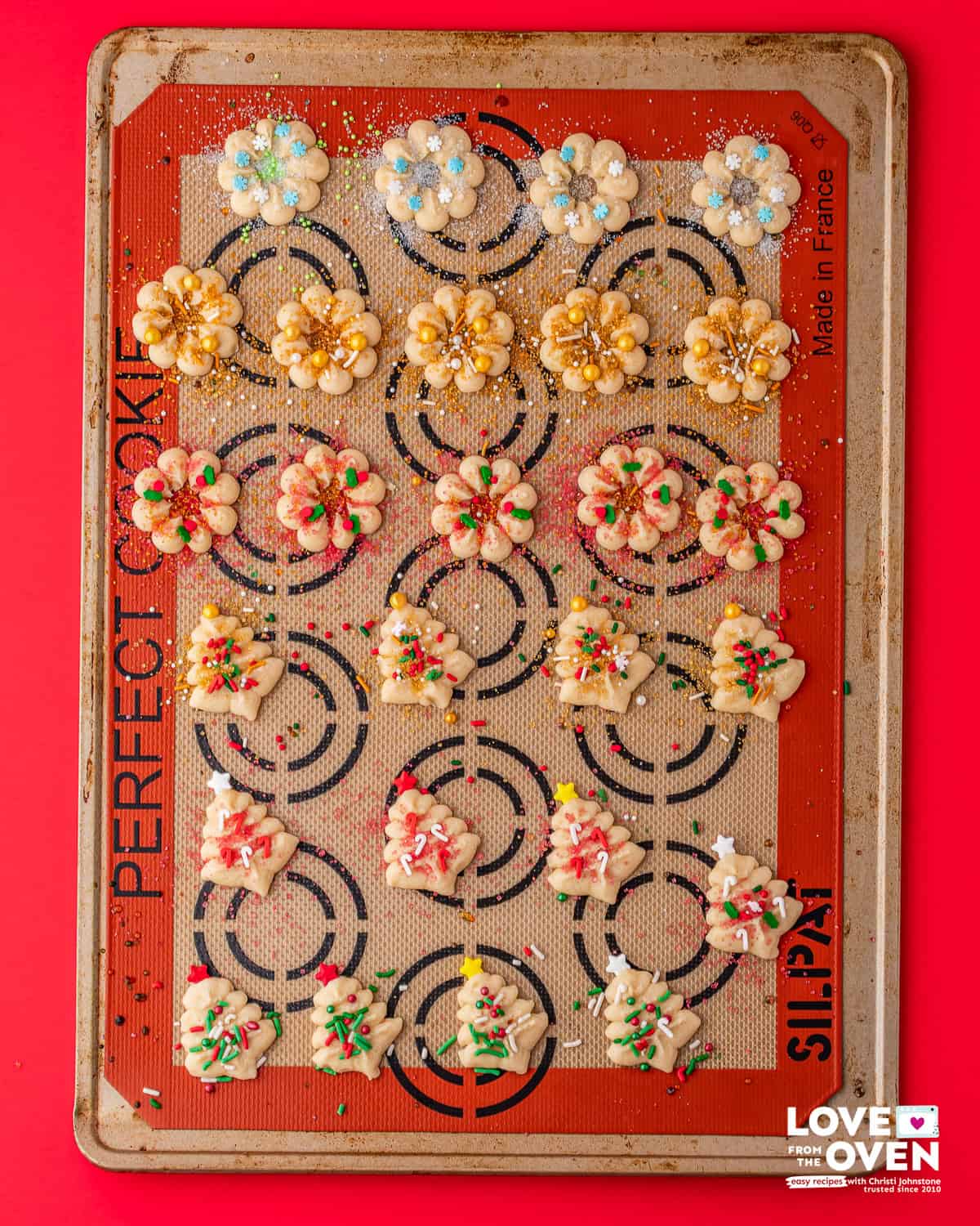Baked Spritz Cookies on a baking sheet