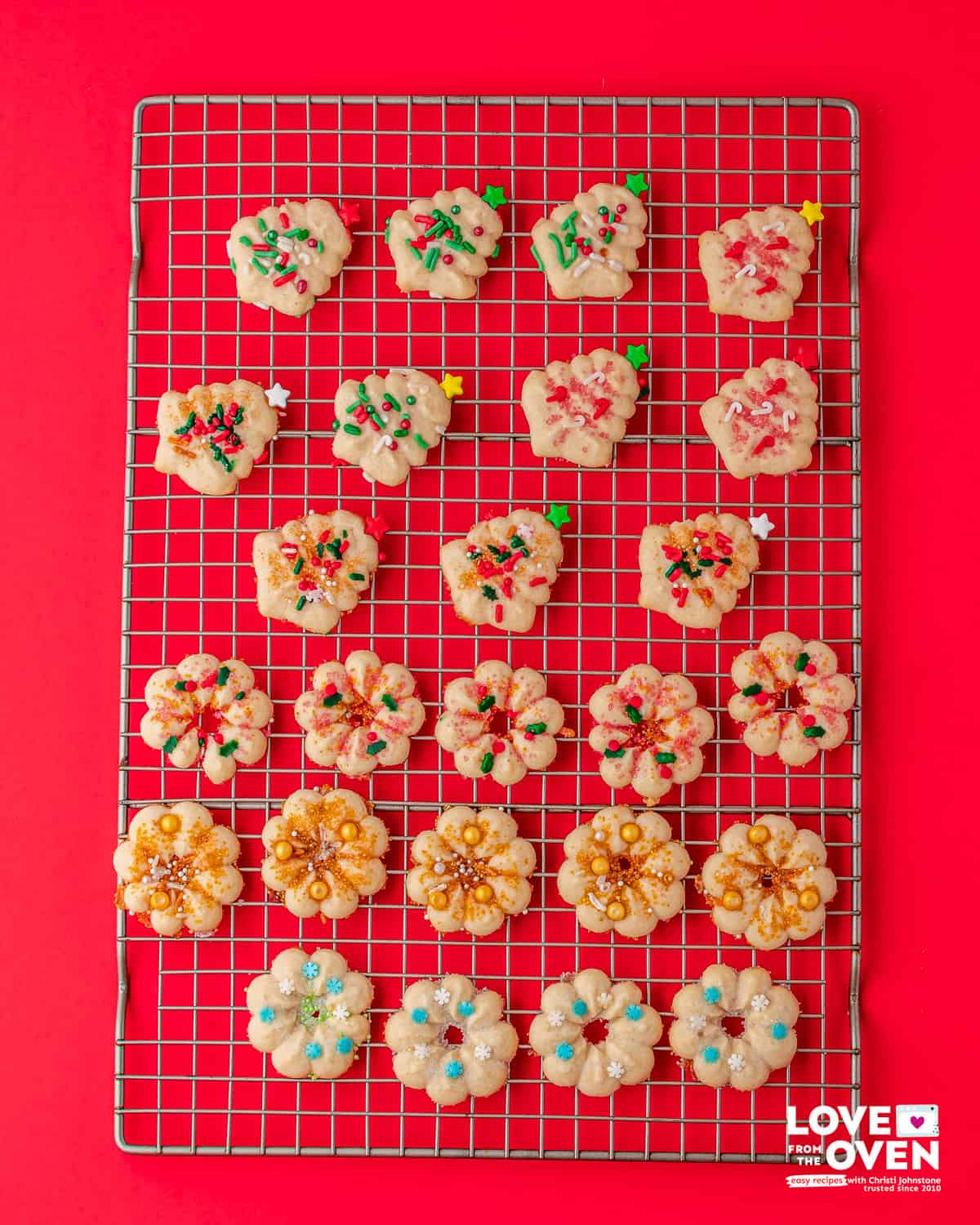 Baked Spritz Cookies on a cooling rack