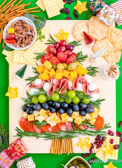 A Christmas charcuterie board on a green background