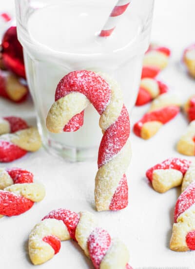 Candy Cane cookies in front of a glass of milk