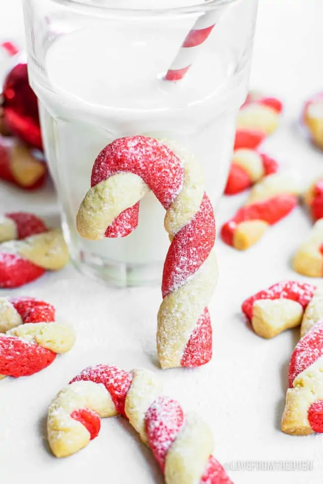 Candy Cane cookies in front of a glass of milk