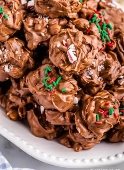A plate of crockpot christmas crack peanut clusters