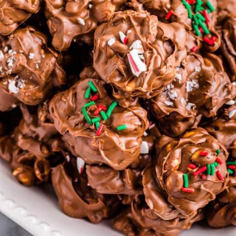 A plate of crockpot christmas crack peanut clusters