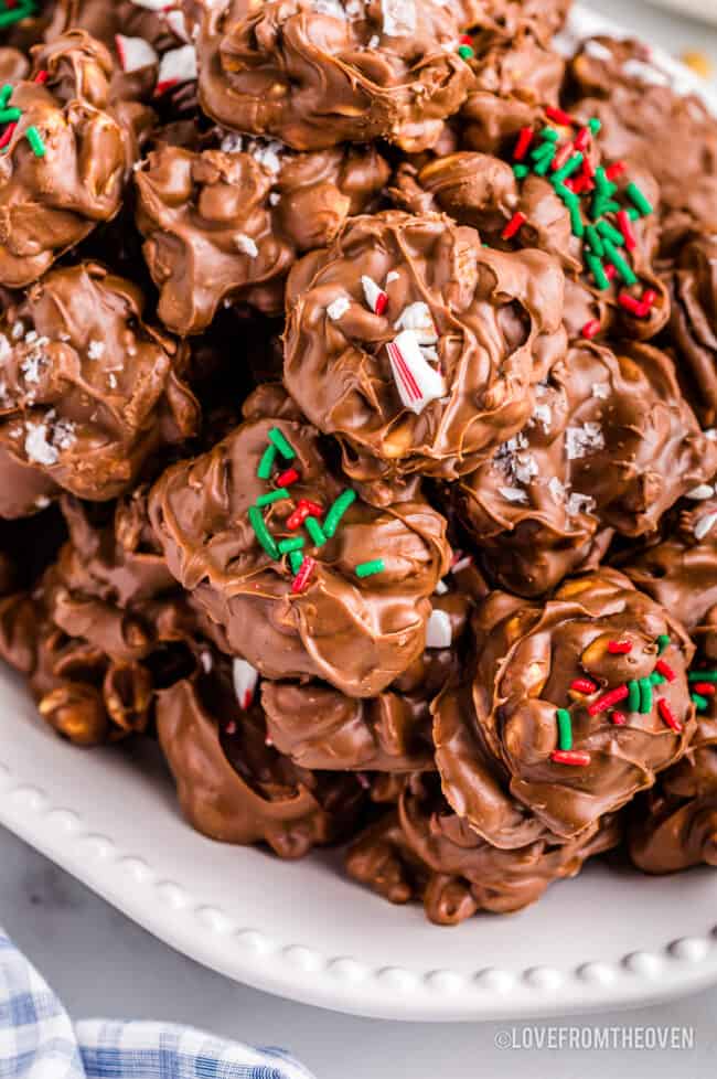 A plate of crockpot christmas crack peanut clusters