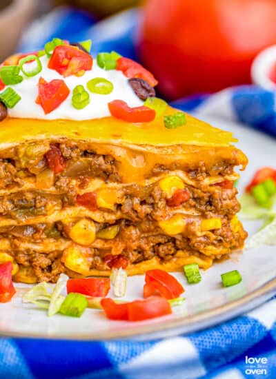 A close up side photo of a slice of taco pie.