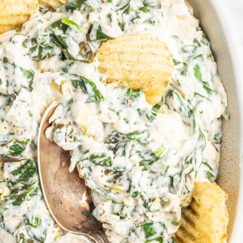 A bowl of crockpot spinach artichoke dip