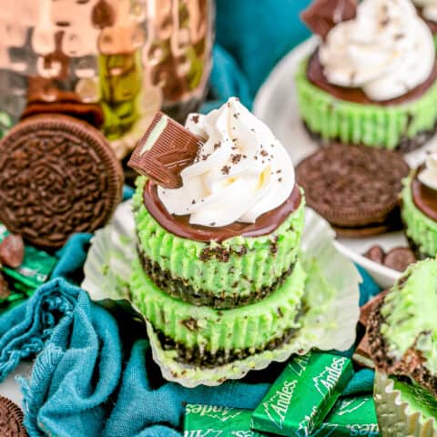 Mint chocolate cheesecakes on a blue background.