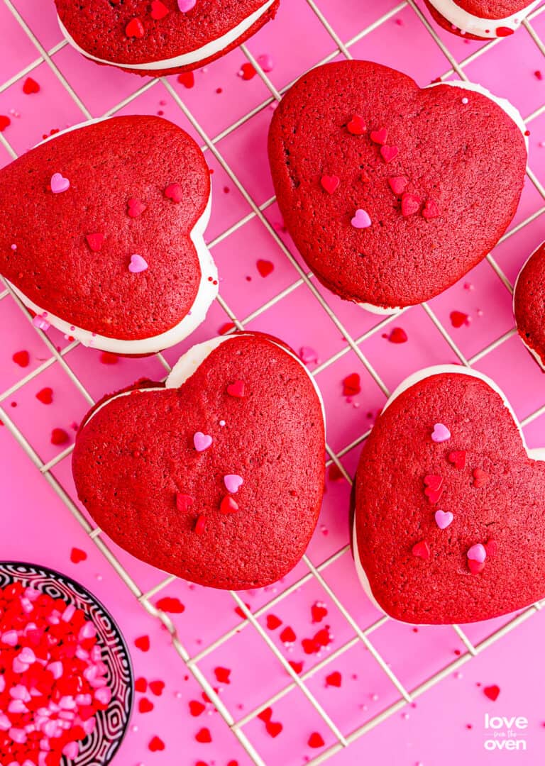 Red velvet whoopie pies on pink background