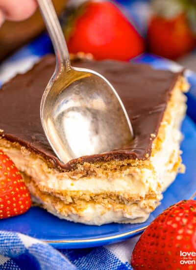 A spoon in a chocolate eclair cake