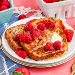 A plate of french toast with berries