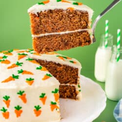 carrot cake with a slice being taken out