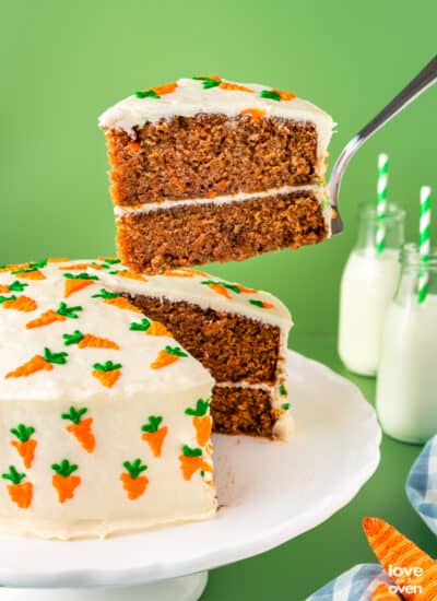 carrot cake with a slice being taken out