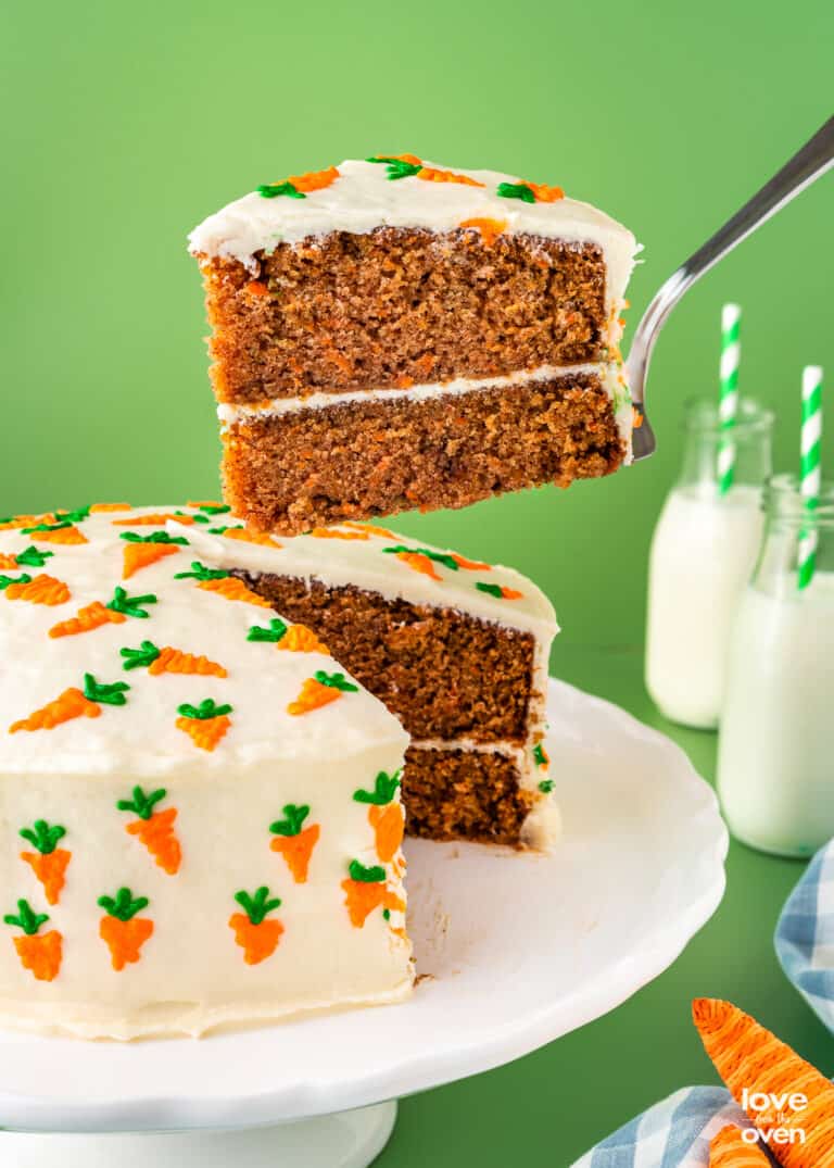 carrot cake with a slice being taken out