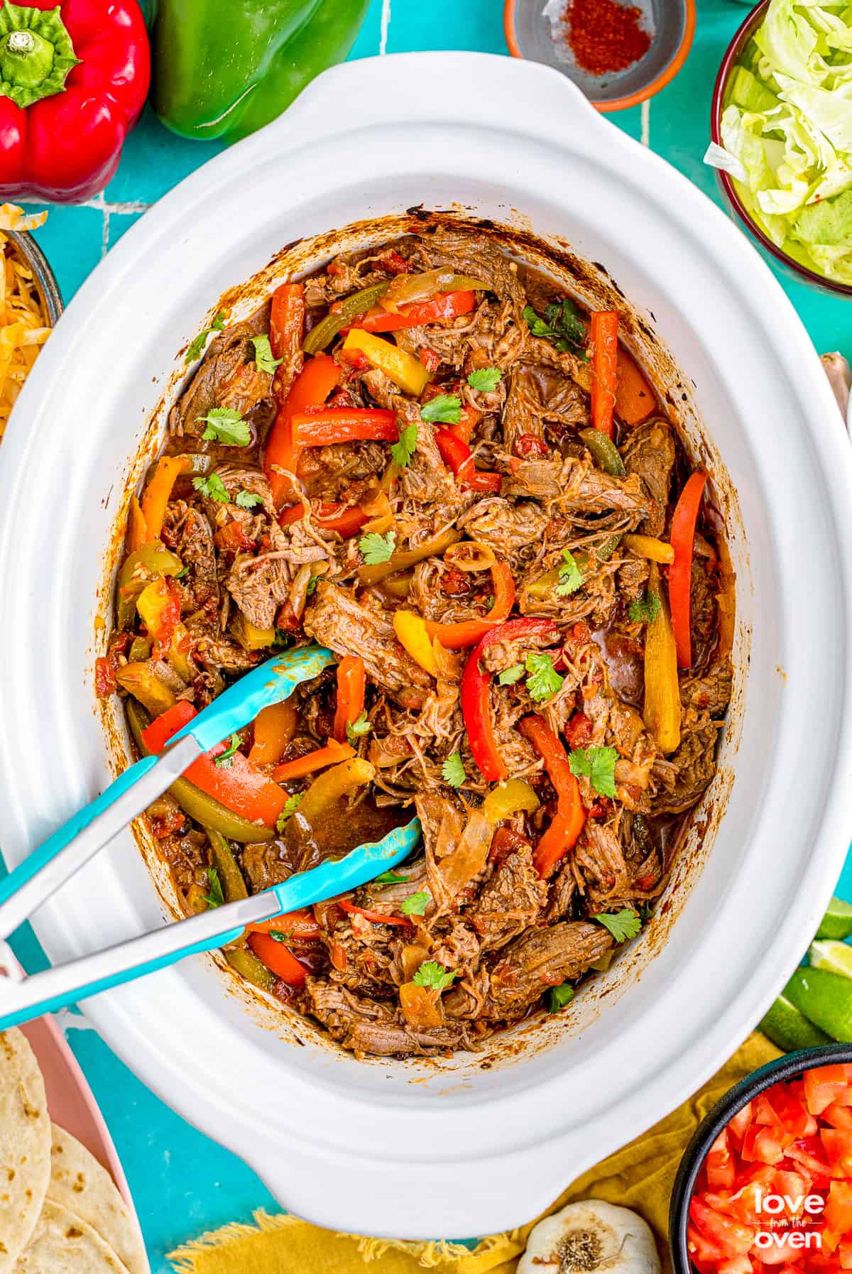 Slow Cooker Flank Steak and Peppers - Deliciously Seasoned