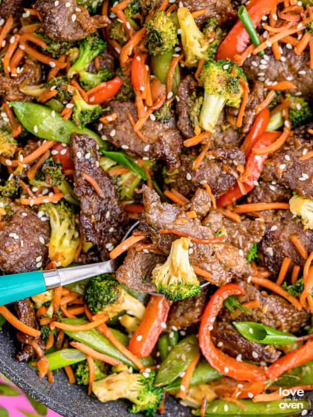 a close up photo of steak stir fry with broccoli