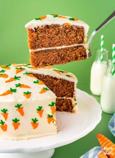 carrot cake with a slice being taken out