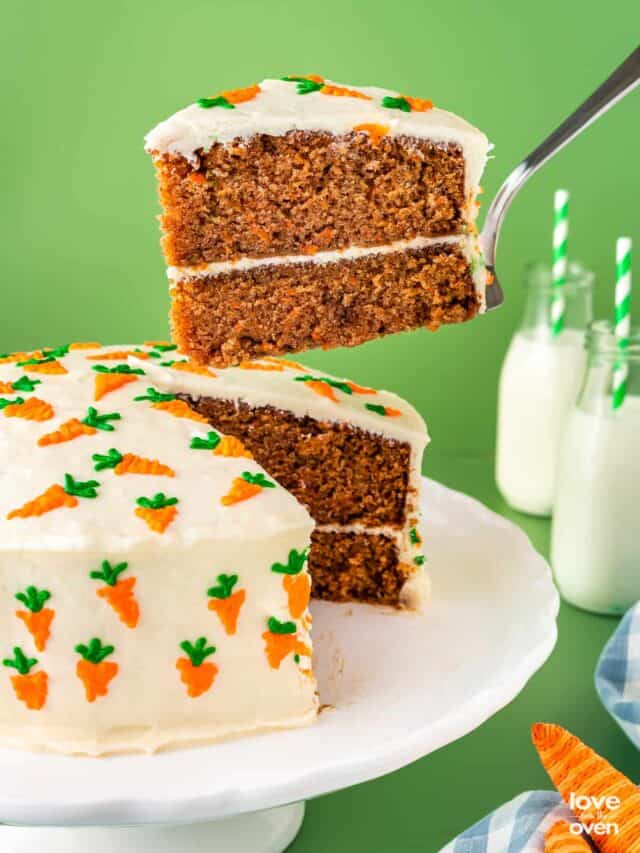 carrot cake with a slice being taken out