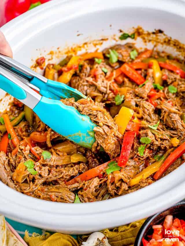 Fajitas in a white crockpot.