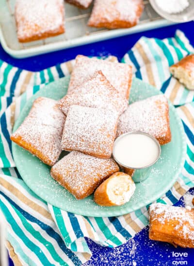 A blue plate of homemade beignets.