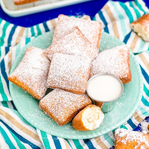 A blue plate of homemade beignets.