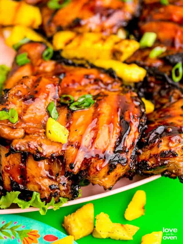Huli Huli Chicken with pineapple on a plate.