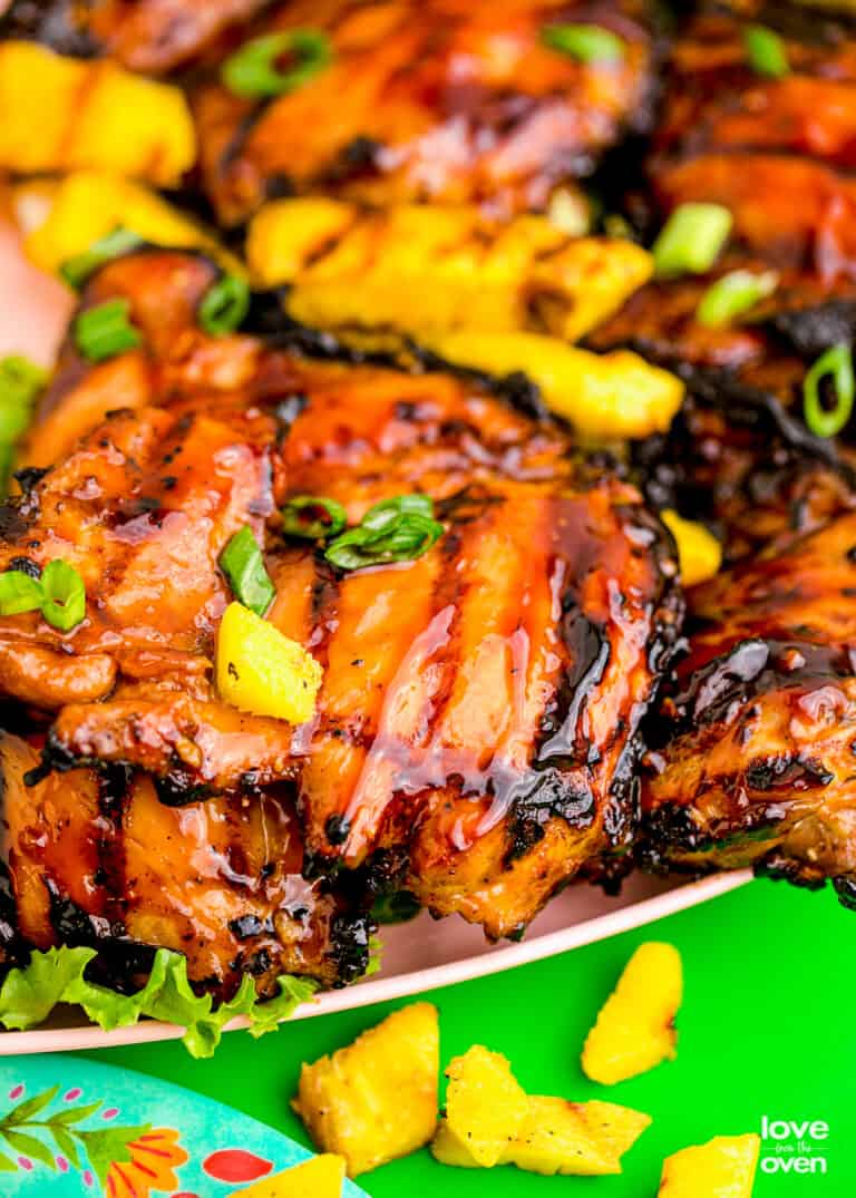 Huli Huli Chicken with pineapple on a plate.