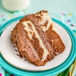 A slice of marble cake on a blue background.