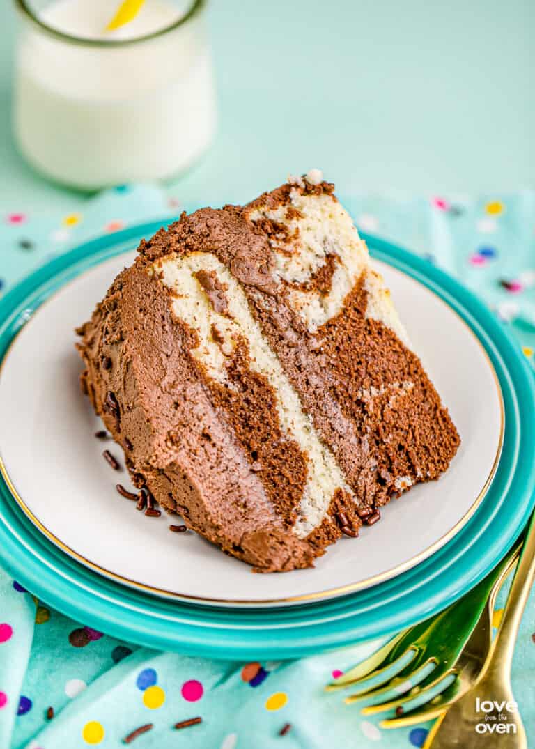 A slice of marble cake on a blue background.